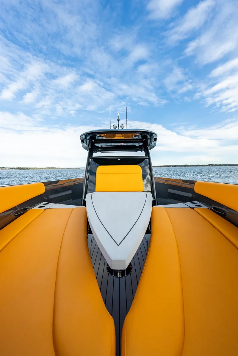 Slide: The Image of 2025 Wajer 38s yacht with vibrant orange seating on open water. - 11