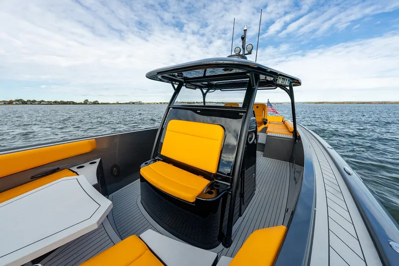 Slide: The Image of 2025 Wajer 38s boat with vibrant yellow seating on open water. - 12