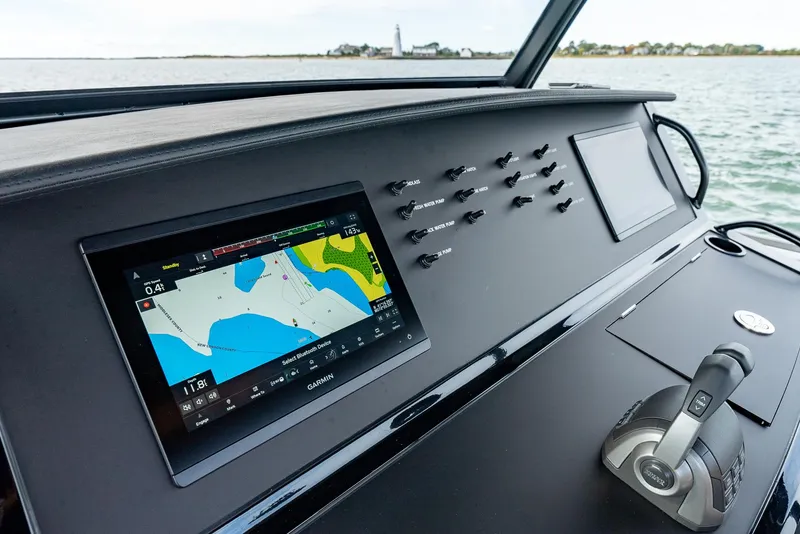 Slide: The Image of 2025 Wajer 38s yacht dashboard with navigation screen and controls. - 20
