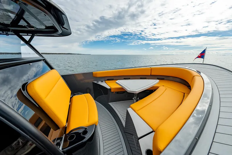 Slide: The Image of Luxurious 2025 Wajer 38s yacht with vibrant orange seating and sleek design on open water. - 3