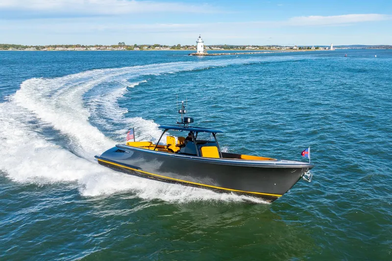 Slide: The Image of 2025 Wajer 38s luxury yacht cruising near a lighthouse on open water. - 35