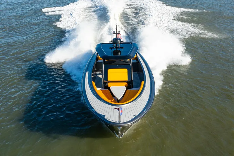 Slide: The Image of 2025 Wajer 38s luxury yacht cruising on open water, aerial view. - 36