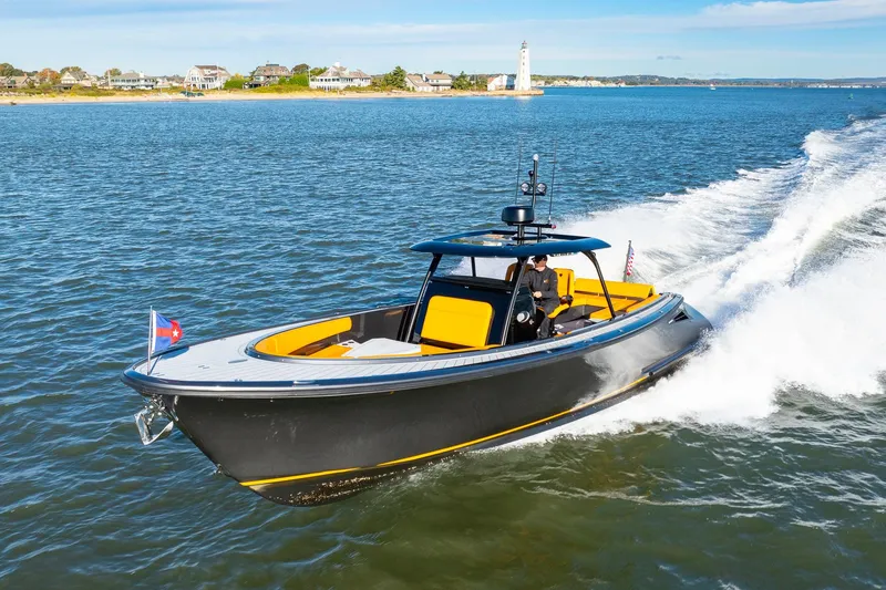 Slide: The Image of 2025 Wajer 38s luxury boat cruising on a sunny day. - 38