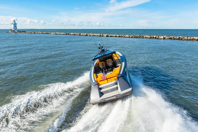 Slide: The Image of 2025 Wajer 38s yacht cruising near a lighthouse on open water. - 39