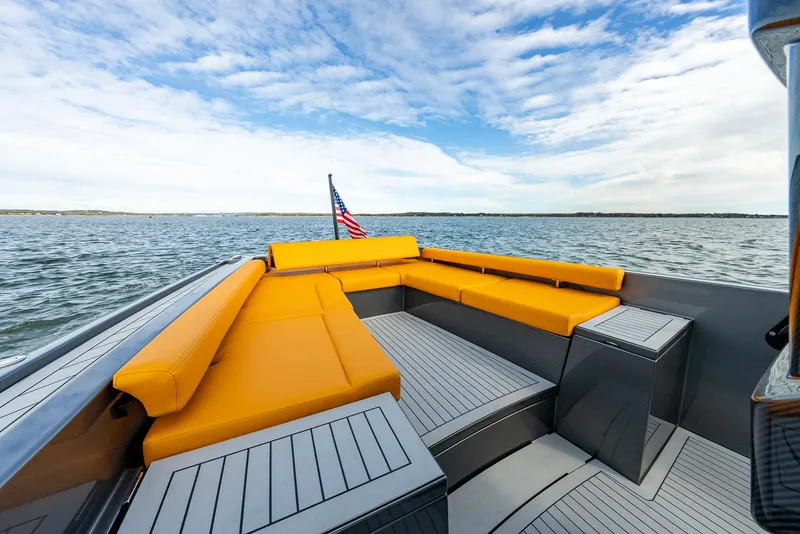 Slide: The Image of Luxurious 2025 Wajer 38s yacht with vibrant orange seating on open water. - 5