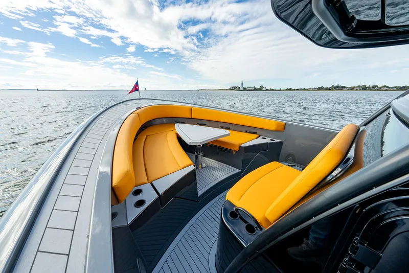 Slide: The Image of Luxury Wajer 38s yacht with vibrant orange seating, 2025 model, cruising on open water. - 8