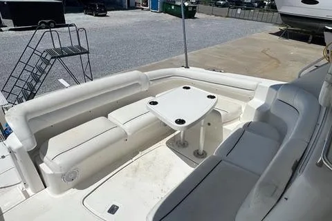 Slide: The Image of 2007 Tiara Yachts 4300 Sovran cockpit with white seating and table. - 13