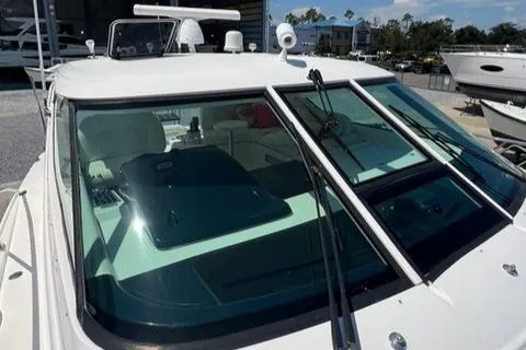 Slide: The Image of 2007 Tiara Yachts 4300 Sovran boat with sleek windshield and wipers in marina setting. - 15