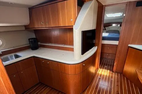 Slide: The Image of Luxurious 2007 Tiara Yachts 4300 Sovran interior with wood cabinetry and modern amenities. - 19