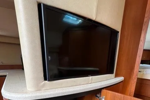 Slide: The Image of 2007 Tiara Yachts 4300 Sovran interior with mounted flat-screen TV. - 22