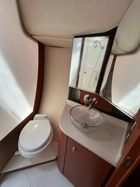 Slide: The Image of 2007 Tiara Yachts 4300 Sovran bathroom with modern sink and toilet. - 28