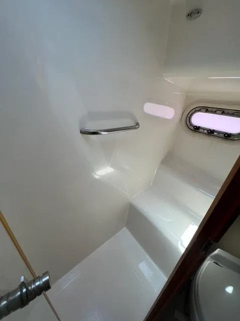 Slide: The Image of 2007 Tiara Yachts 4300 Sovran bathroom interior with window and sleek design. - 30