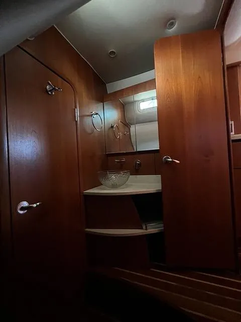 Slide: The Image of Interior of 2007 Tiara Yachts 4300 Sovran, featuring wooden cabinetry and modern fixtures. - 35
