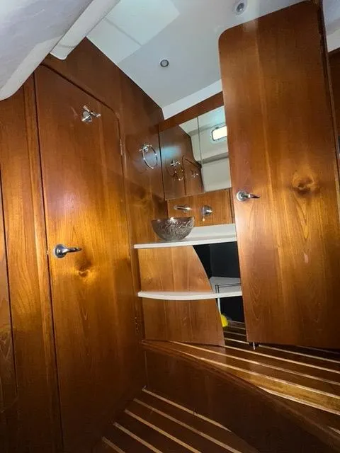 Slide: The Image of 2007 Tiara Yachts 4300 Sovran interior with wooden cabinetry and modern design. - 40