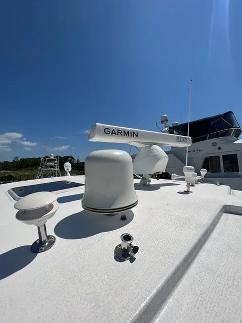 Slide: The Image of 2007 Tiara Yachts 4300 Sovran with Garmin equipment under clear blue sky. - 43