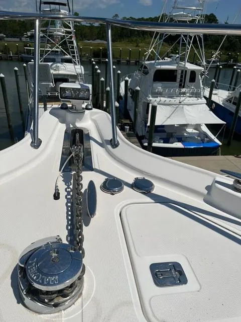Slide: The Image of 2007 Tiara Yachts 4300 Sovran bow with anchor chain, docked in marina. - 44
