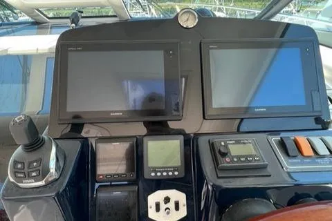 Slide: The Image of 2007 Tiara Yachts 4300 Sovran helm with Garmin navigation displays and controls. - 9