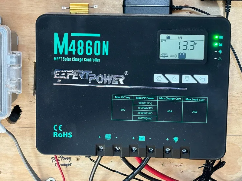 Slide: The Image of MPPT solar charge controller on 2022 Custom MKI Pontoon Boat, displaying 13.3V. - 5