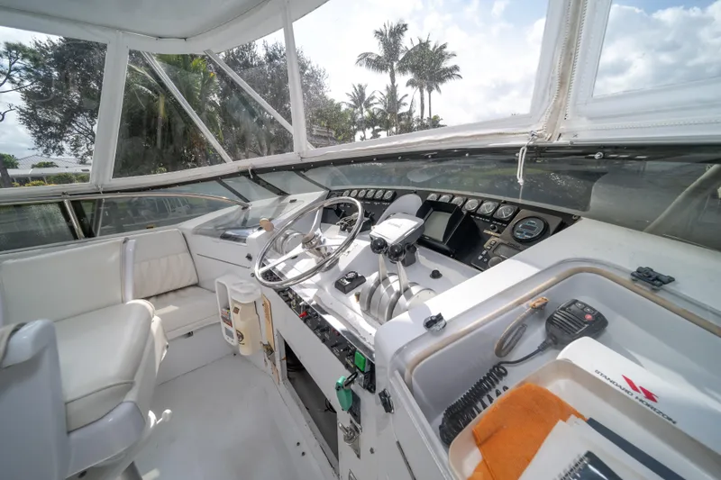 Slide: The Image of Interior helm of 1999 Hatteras 52 Cockpit Motor Yacht with steering wheel and controls. - 15