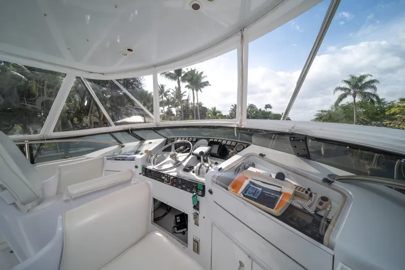 Slide: The Image of Interior cockpit view of 1999 Hatteras 52 Cockpit Motor Yacht with steering controls. - 16