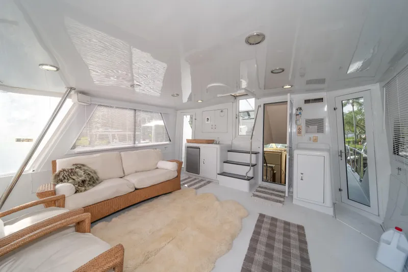 Slide: The Image of Luxurious interior of 1999 Hatteras 52 Cockpit Motor Yacht with plush seating and modern amenities. - 21