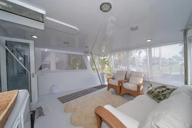 Slide: The Image of Spacious interior of 1999 Hatteras 52 Cockpit Motor Yacht with comfortable seating. - 23