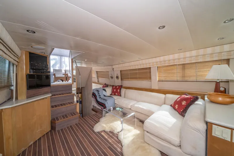 Slide: The Image of Luxurious interior of 1999 Hatteras 52 Cockpit Motor Yacht with plush seating and modern decor. - 25