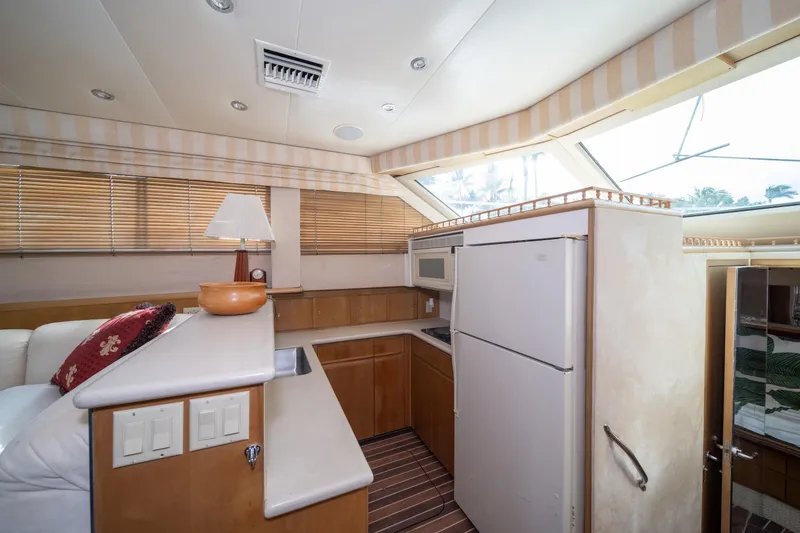 Slide: The Image of Interior of 1999 Hatteras 52 Cockpit Motor Yacht kitchen with modern appliances. - 30