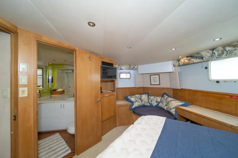Slide: The Image of Interior of 1999 Hatteras 52 Cockpit Motor Yacht with cozy bedroom and ensuite bathroom. - 36