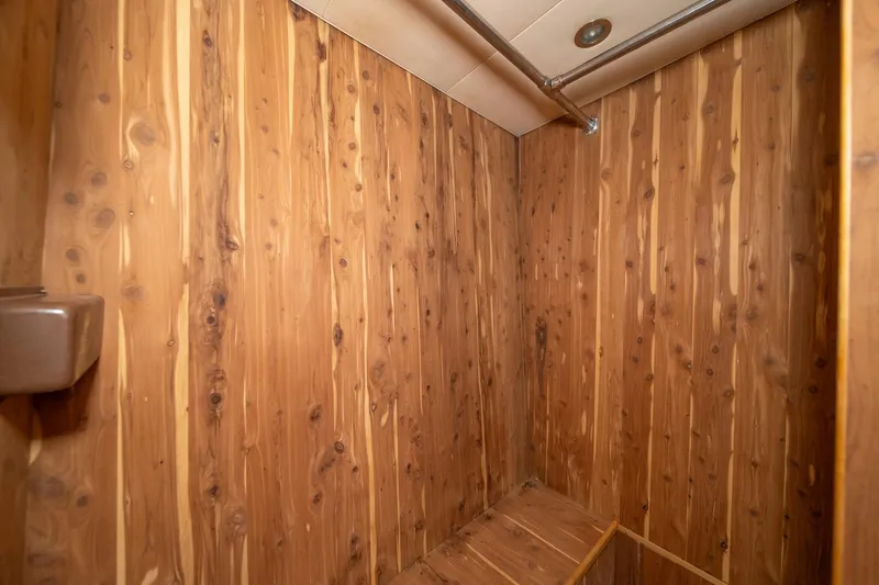 Slide: The Image of Wood-paneled interior of 1999 Hatteras 52 Cockpit Motor Yacht. - 37