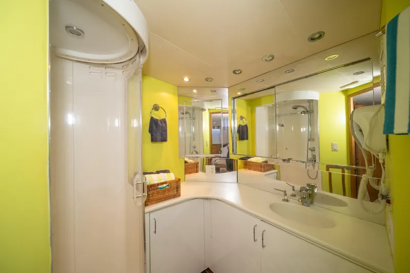 Slide: The Image of Bright bathroom in 1999 Hatteras 52 Cockpit Motor Yacht with shower and mirrored cabinets. - 39