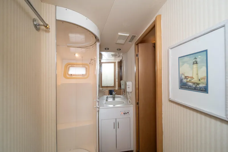 Slide: The Image of Bathroom interior of 1999 Hatteras 52 Cockpit Motor Yacht with shower and sink. - 43
