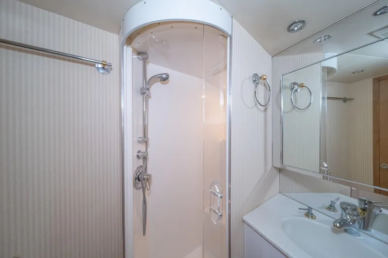 Slide: The Image of Bathroom interior of 1999 Hatteras 52 Cockpit Motor Yacht with shower and sink. - 44