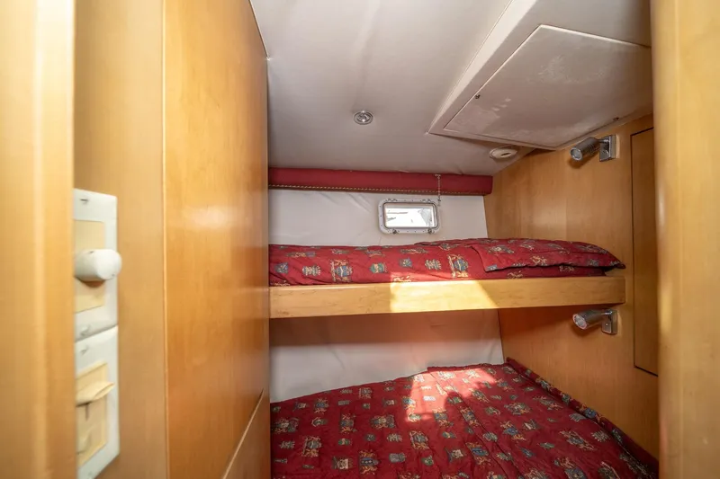Slide: The Image of Bunk beds in 1999 Hatteras 52 Cockpit Motor Yacht cabin with red bedding. - 46