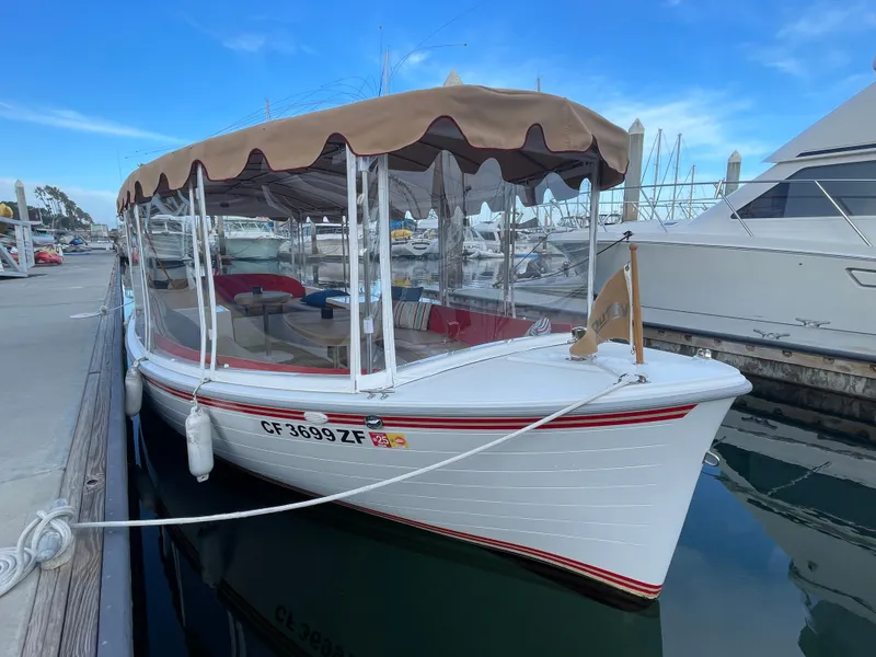 Slide: The Image of 2018 Duffy Bay Island 22 electric boat docked at marina. - 4