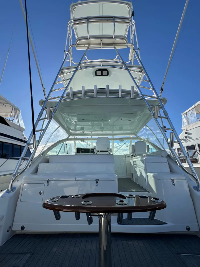 Slide: The Image of 2005 Cabo 40 Express yacht with tower and spacious deck. - 8