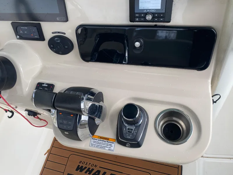 Slide: The Image of Control panel of 2020 Boston Whaler 280 Outrage boat with throttle and navigation controls. - 20