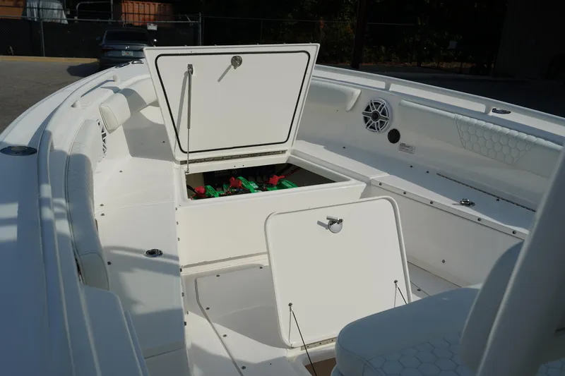 Slide: The Image of 2015 Everglades 243 CC boat interior with open storage compartments. - 15
