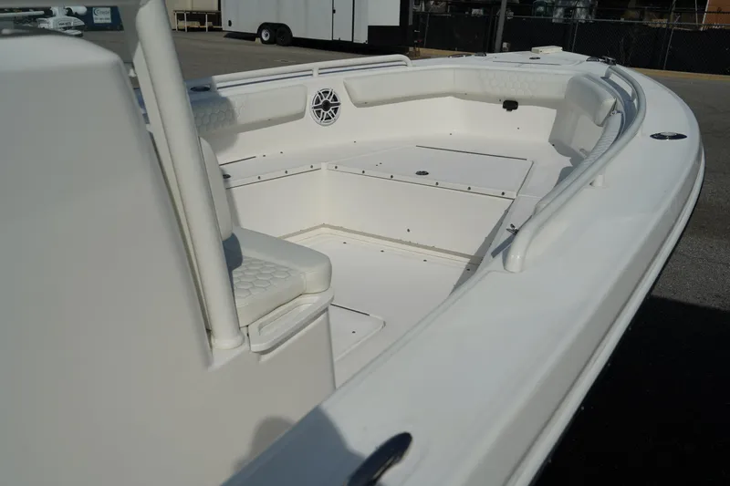 Slide: The Image of 2015 Everglades 243 CC boat interior, featuring spacious seating and storage. - 17