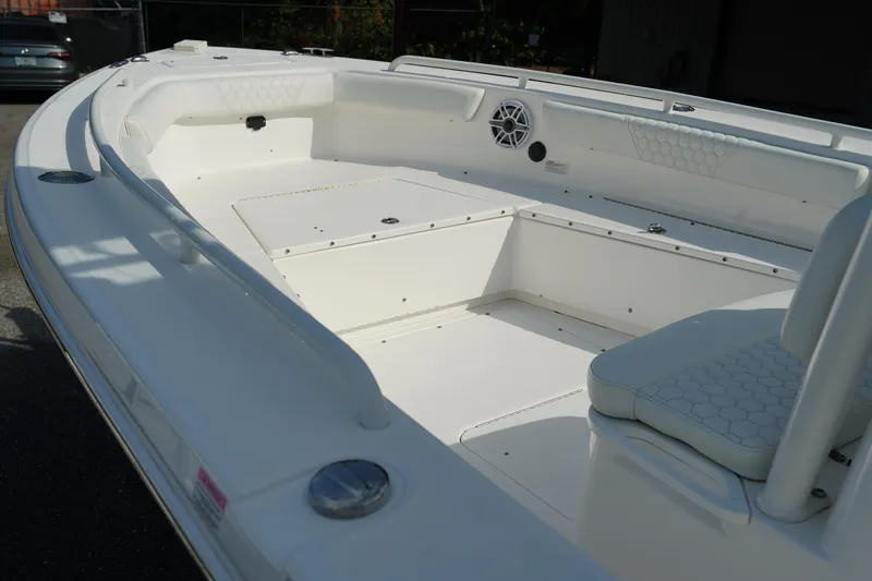Slide: The Image of 2015 Everglades 243 CC boat interior, featuring spacious seating and sleek design. - 18