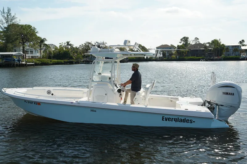 Slide: The Image of 2015 Everglades 243 CC boat on calm water with Yamaha engine. - 2