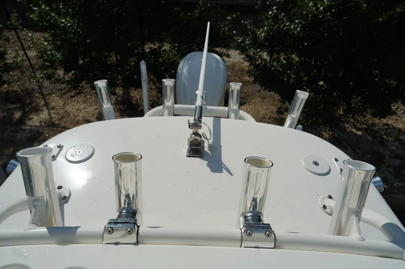 Slide: The Image of 2015 Everglades 243 CC boat with multiple rod holders and antenna. - 21