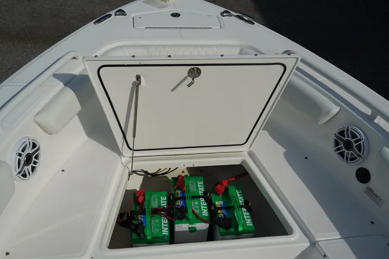Slide: The Image of Everglades 243 CC 2015 boat with open storage compartment and batteries. - 25
