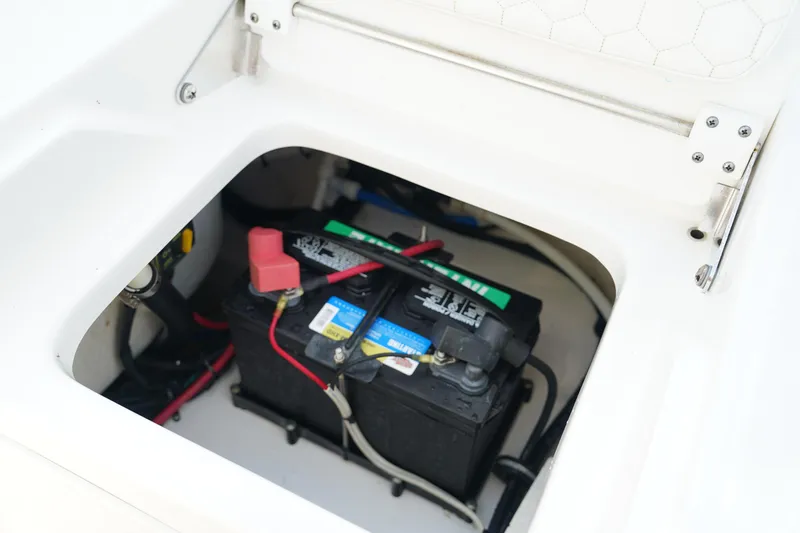 Slide: The Image of Battery compartment of 2015 Everglades 243 CC boat, showing wiring and connections. - 26