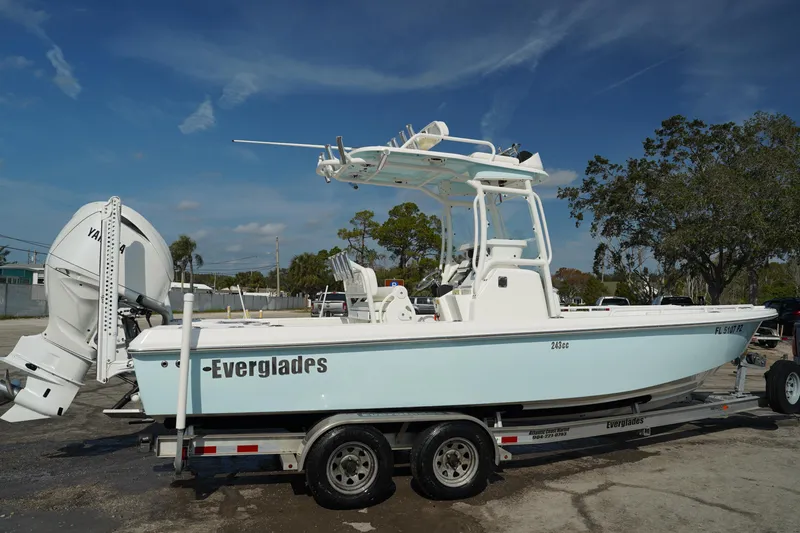Slide: The Image of 2015 Everglades 243 CC boat on trailer, side view, clear sky background. - 3