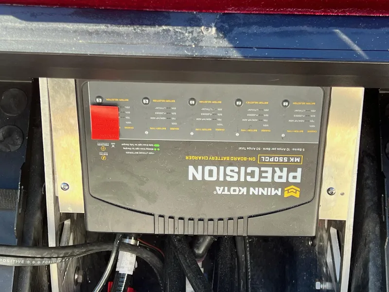 Slide: The Image of Minn Kota Precision onboard battery charger in a 2025 Skeeter ZXR 21 boat. - 19
