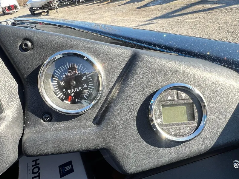 Slide: The Image of Dashboard of 2025 Skeeter ZXR 21 with water pressure gauge and digital display. - 37