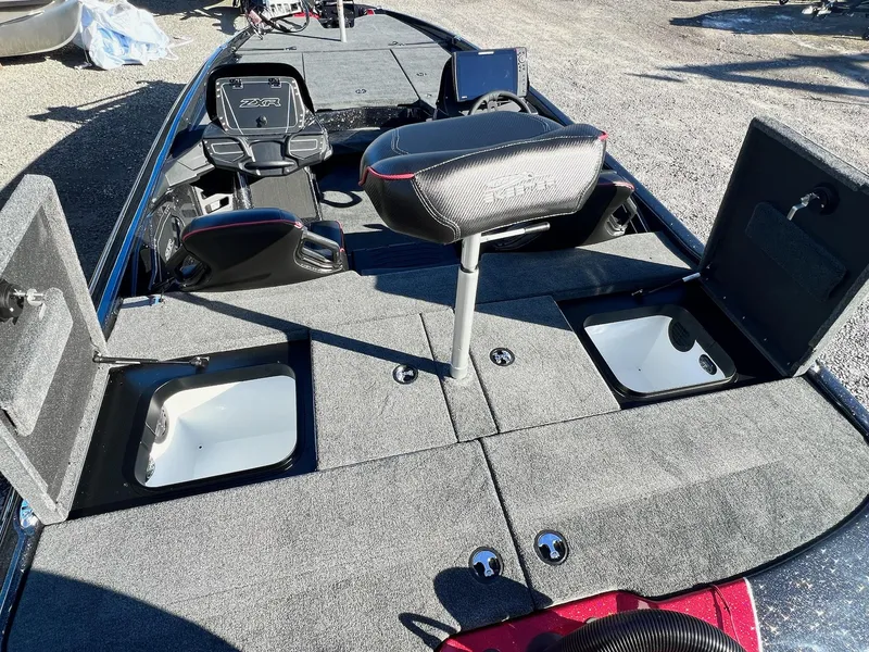 Slide: The Image of 2025 Skeeter ZXR 21 boat interior with open storage compartments and seating. - 40