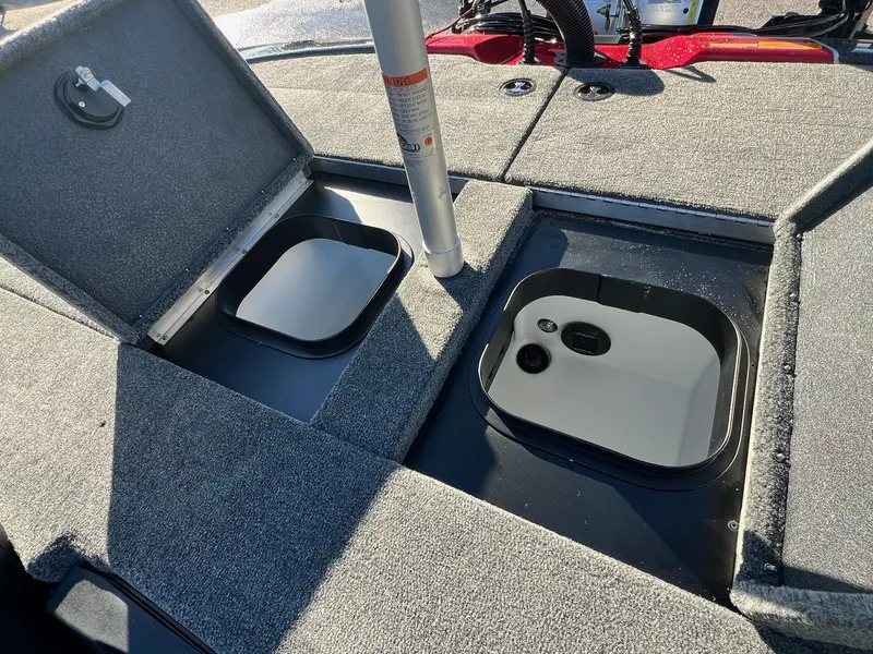 Slide: The Image of 2025 Skeeter ZXR 21 boat interior with open storage compartments. - 7