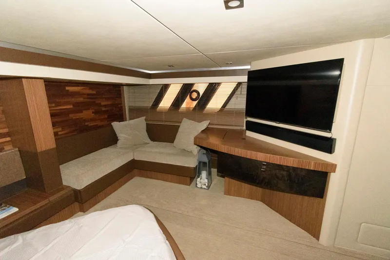 Slide: The Image of Luxurious interior of 2016 Sea Ray L590 Fly yacht with modern seating and TV. - 34
